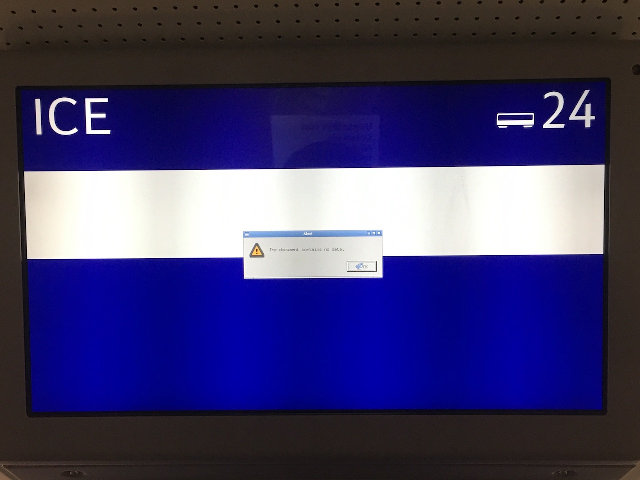 ICE train info screen with a pop up which says alert, the document contains no data