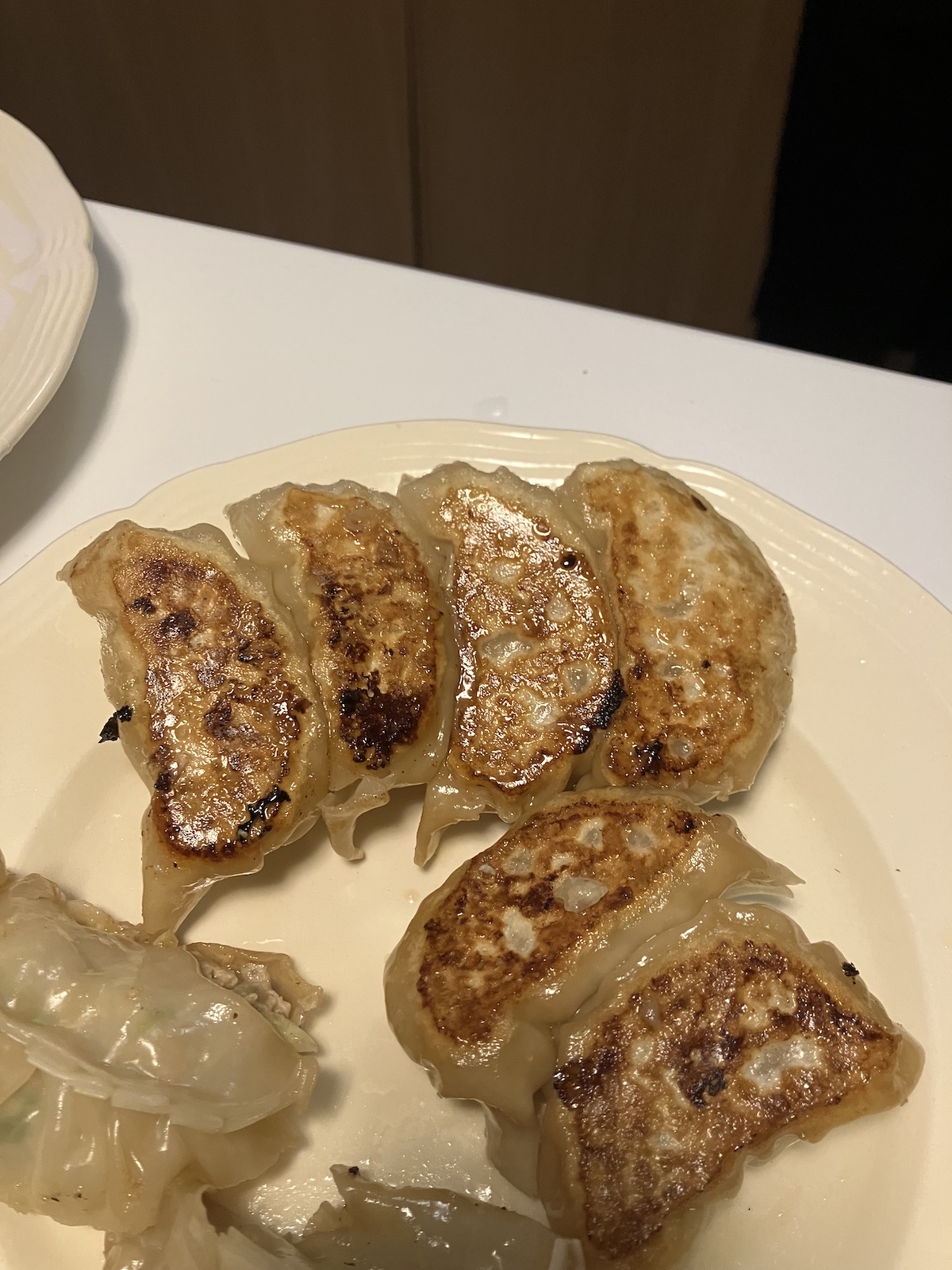 around eight pieces of dumplings, cooked and have golden color